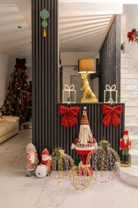 a room with a christmas tree and christmas decorations at Hotel Boutique Tunari in Tunari