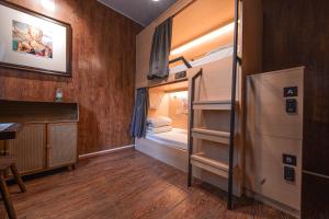 a room with two bunk beds and a desk at POSHPACKER - Chengdu Mix Hostel - Cicada Zen Yard in Chengdu +210 photos