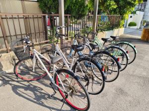a row of bikes parked next to each other at DiDi Calm 105 in Tokushima