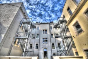 an apartment building with stairs on the side of it at SC Pula Rooms & Studio in Pula