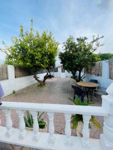 a view of a patio with trees and a table at Muy bien in San Javier