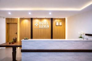 a hotel lobby with a hotel tavern sign on the wall at Hotel Eleven in Kathmandu