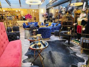 a store with blue and pink couches and chairs at Boutique Hotel am Bodensee in Friedrichshafen