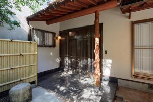 a front porch of a house with a pole at 修善寺あざみ Luxury Japanese Villa with Mt Fuji Views and Onsen in Izu
