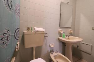 a small bathroom with a toilet and a sink at Casa Giselle in Otranto in Otranto +14 photos