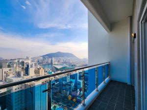 a balcony with a view of a city at Paramion Hotel in Busan