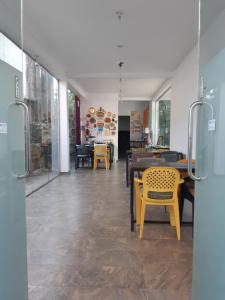 a room with chairs and tables in a store at Siril Guesthouse Hostel in Nuwara Eliya +38 photos