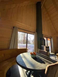 a living room with a table and a couch at Bosnest Nr 176 in Frankenau