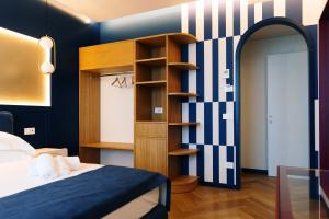 a bedroom with a bed and a book shelf at SetSail in Vibo Valentia Marina