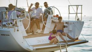 a group of people sitting on a boat in the water at Z6 Dolcevita Signature - Villa & Private Yacht in the Heart of Rovinj in Rovinj