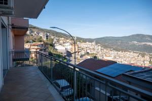 a balcony with a view of a city at House Gennauara in Lanusei