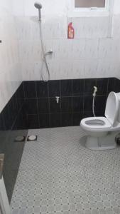 a bathroom with a toilet and a shower at New Moon in Maharagama
