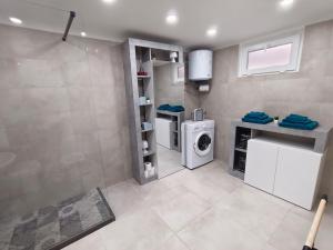a laundry room with a washer and dryer at Dimora Pietra e Mare Trani in Trani