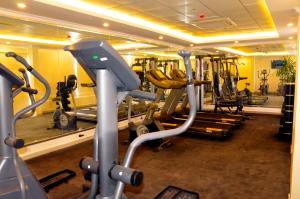 a gym with several tread machines in a room at Jubail Inn in Al Jubail