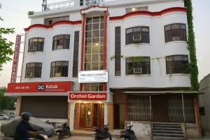 a building with motorcycles parked in front of it at Hotel Orchid Garden Karol Bagh in New Delhi