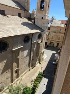 an aerial view of a building with a clock tower at A casa di Ada in Finale Ligure
