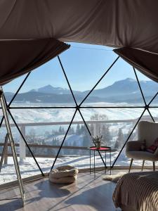 a room with a large window with a view at Forest glamp in Yasinya +13 photos