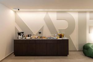 a kitchen with a counter with food on it at Mariette Rhodes Urban Suites in Rhodes Town
