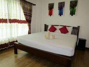 Postel nebo postele na pokoji v ubytování รีสอร์ทที่ลำปาง (Resort At Lampang)