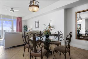 a dining room with a table and chairs at Turquoise Place 408C in Orange Beach +45 photos