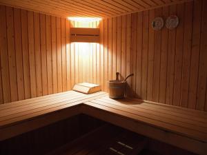 a inside of a sauna with a bucket in it at Cottage in the heart of the Ardennes in Waimes