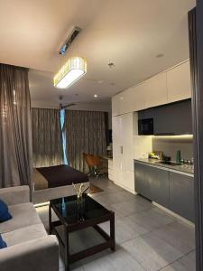 a living room with a couch and a table at Spira staycation in New Delhi
