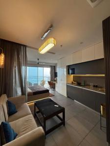 a living room with a couch and a table at Spira staycation in New Delhi +6 photos