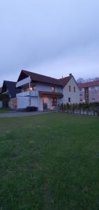 a large white house with a large grass field at Ferienwohnung Wille in Lünen