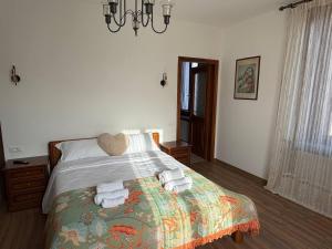 a bedroom with a bed with towels on it at "The Moment"- rooms Bergamo center, self check-in, late Arrivals in Bergamo