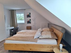 a bedroom with a bed with a wooden frame at Moderne Wohnung in Krefeld in Krefeld