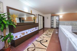 A bed or beds in a room at Парк Апарт-Хотел Виктория 1
