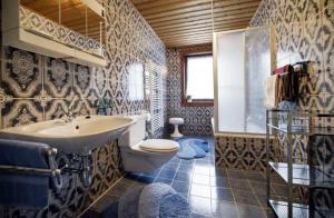 a bathroom with a sink and a toilet at White Summit Appartement in Vandans