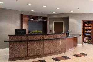 a lobby with a bar in a hotel at Courtyard by Marriott Ontario Rancho Cucamonga in Rancho Cucamonga +62 photos