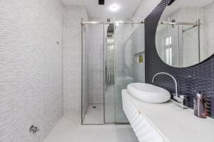 a bathroom with a sink and a shower at Villa Belle Azure by PikHost in Dhërmi +42 photos