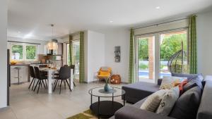 a living room with a couch and a table at Vila LeDa by Villas Guide in Barban