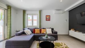 a living room with a couch and a table at Vila LeDa by Villas Guide in Barban