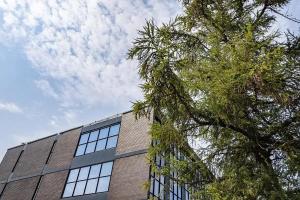 a tall building with a tree in front of it at For Students Only Space St Andrews in St. Andrews