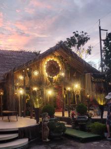 a building with christmas lights in front of it at Phumaihom Resort in Hat Yai