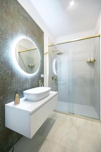 a bathroom with a sink and a mirror at D'AlottoSuite&Rooms in Leonforte +25 photos