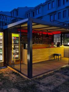 a building with a bar with wine bottles at Dione Bozcaada in Bozcaada