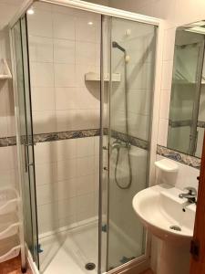 a bathroom with a shower and a sink at Jeribel PlayA1 in Fuengirola