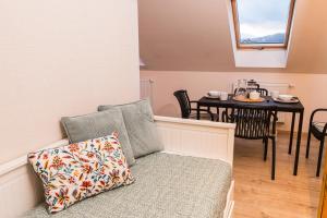 a living room with a couch and a table at V&D 7 by Mountain ways in Rokytnice nad Jizerou