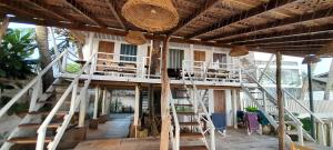 a room with stairs and chairs in a house at Amaranthe Beach Cabanas in Galle +31 photos