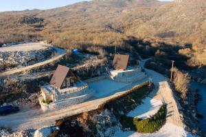 an aerial view of a house on a bridge over a river at Apartmani Janjusevic 2 in Mali Zakrnjak