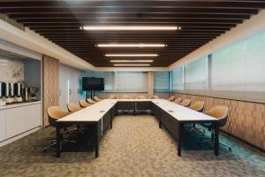 a conference room with a long table and chairs at Stillo Business Hotel & Spa in Aliağa +18 photos