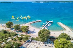 an aerial view of a beach with boats in the water at Camping Bi Village - Maeva Vacansoleil in Valbandon