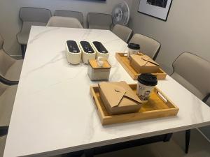 a table with three cell phones on top of it at Sunlight Heyun B&B in Yuanshan