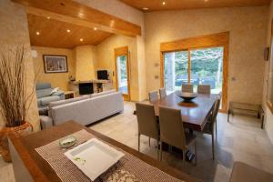a dining room and living room with a table and chairs at Spacious Countryside Costa Brava Relax in Sils