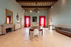 a large living room with a table and a couch at Palazzo Sbaraglini in Assisi