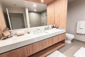 a bathroom with a sink and a toilet at Stylish Condo at The Crosby in Miami